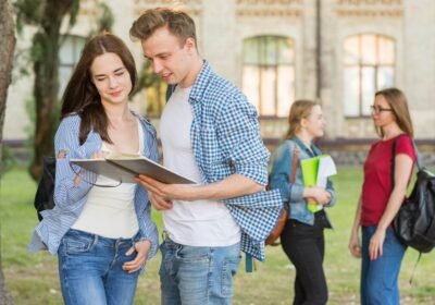 group-young-students-front-school-building_23-2148199271